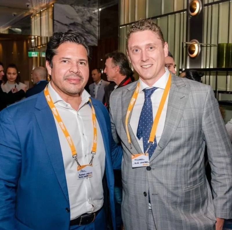 Guests posing together at an indoor industry event